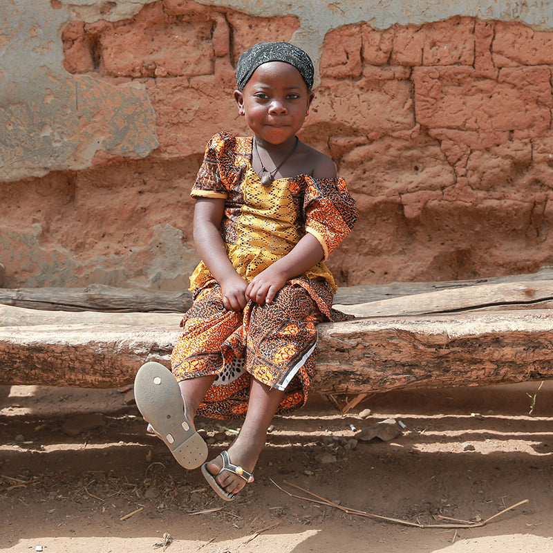 Child sitting on bench