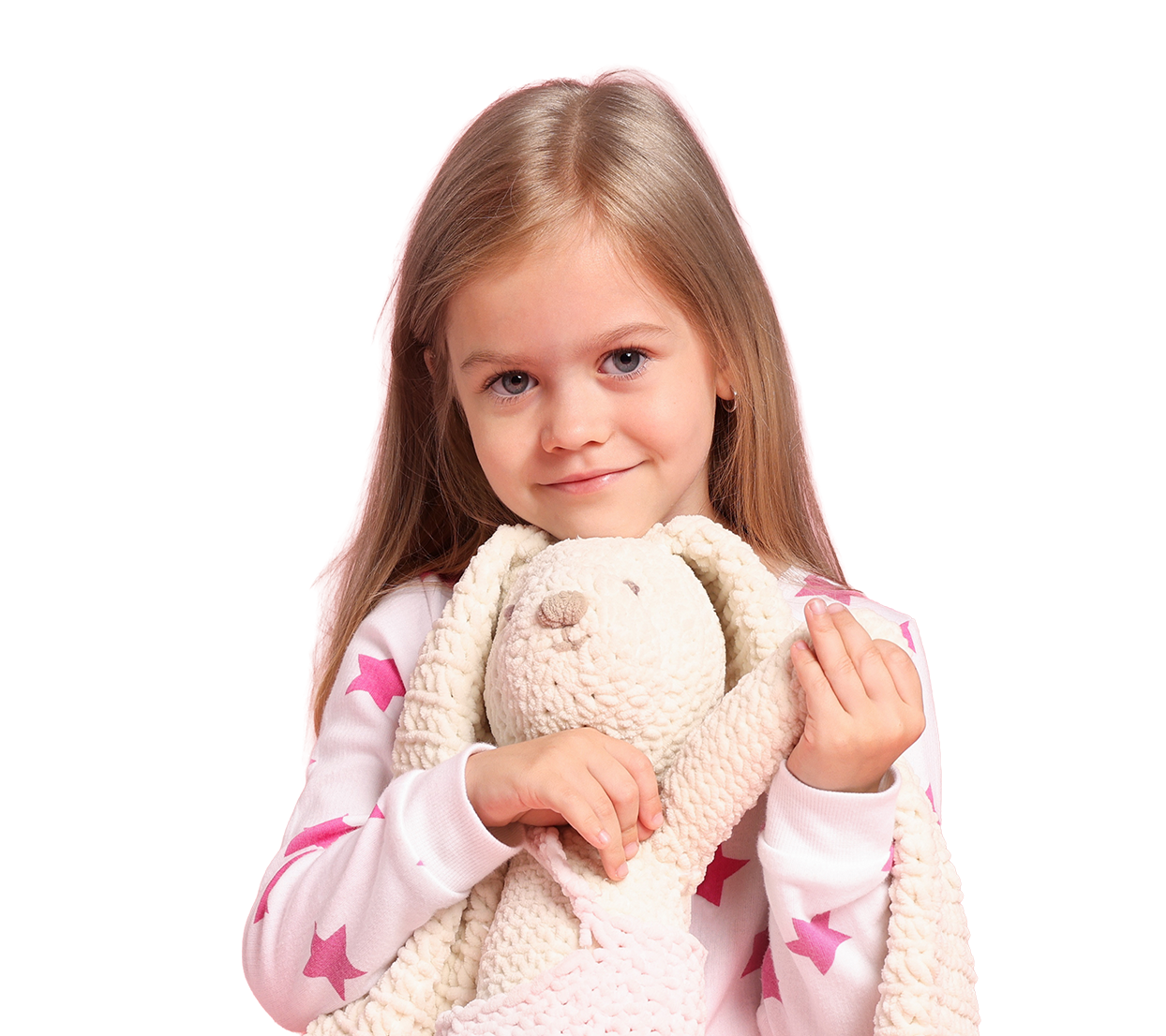 Young girl holding a plush toy