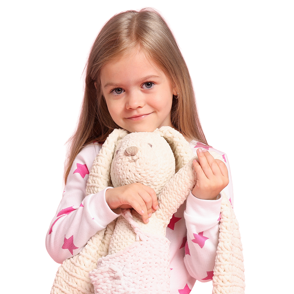 Young girl holding a plush toy
