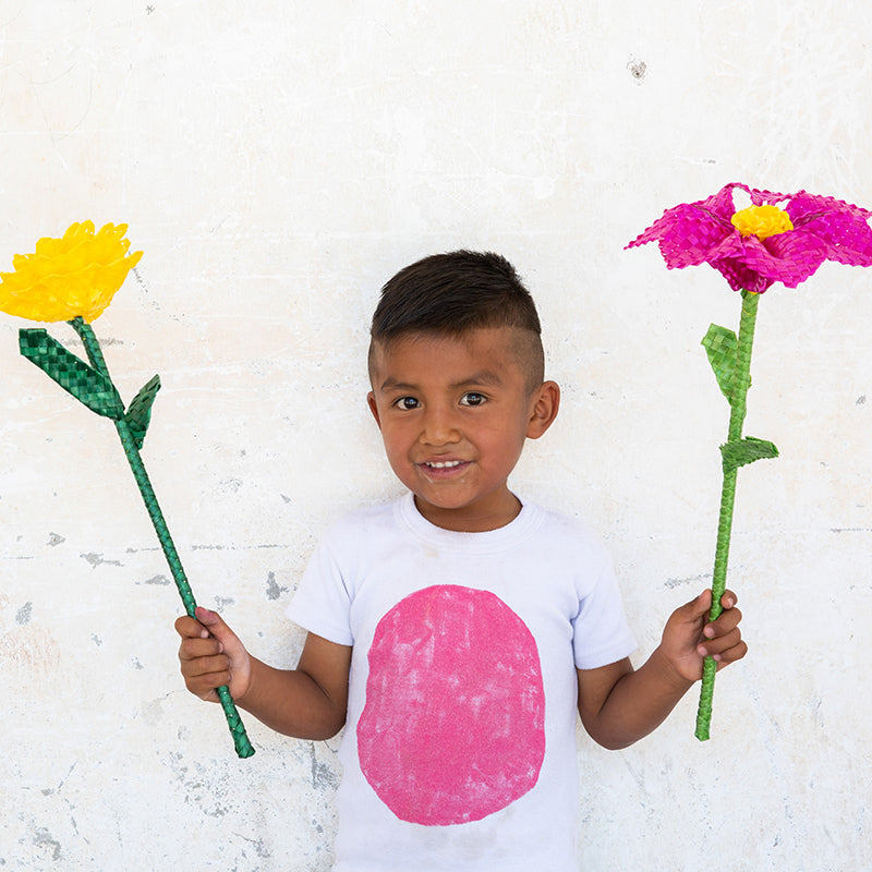 Boy holding flower decorations