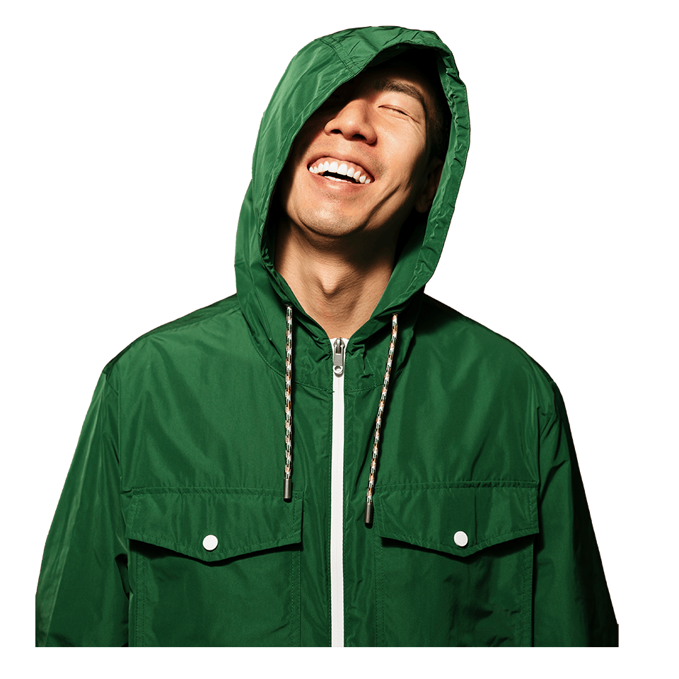 joyful man in a green hoodie