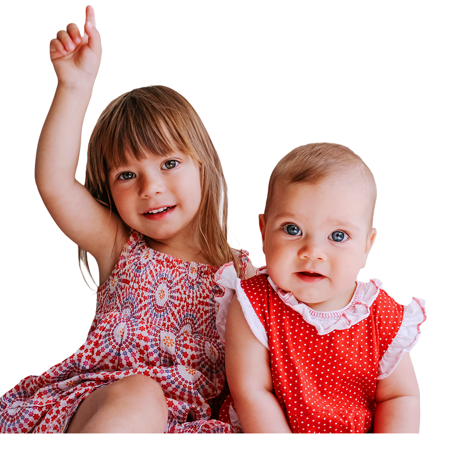 two toddlers with sparkling eyes