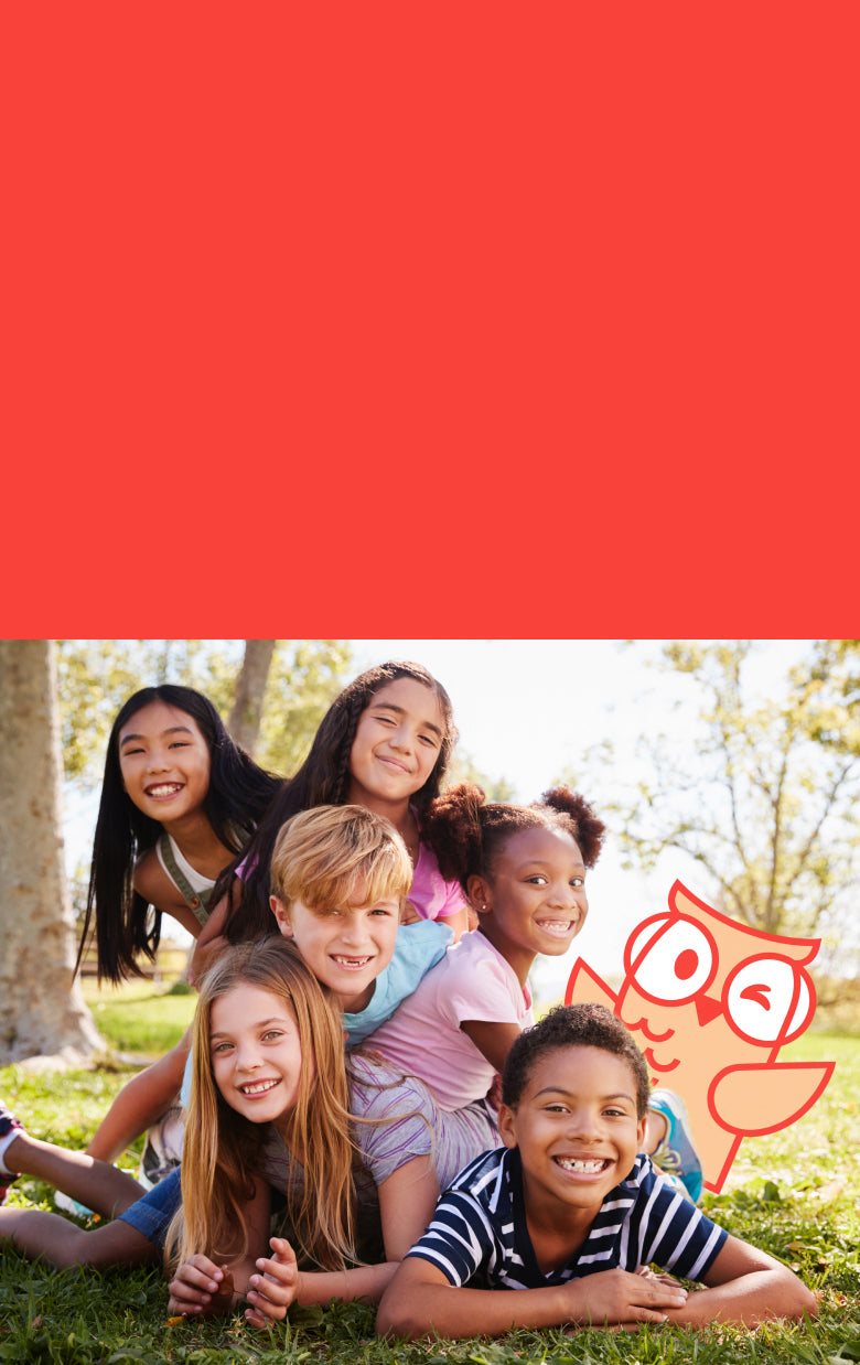 Children posing outdoors with a red background featuring Athena the owl.
