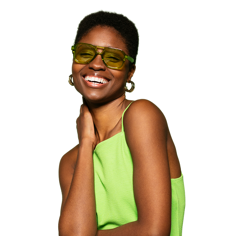 Woman wearing green sunglasses and a green dress