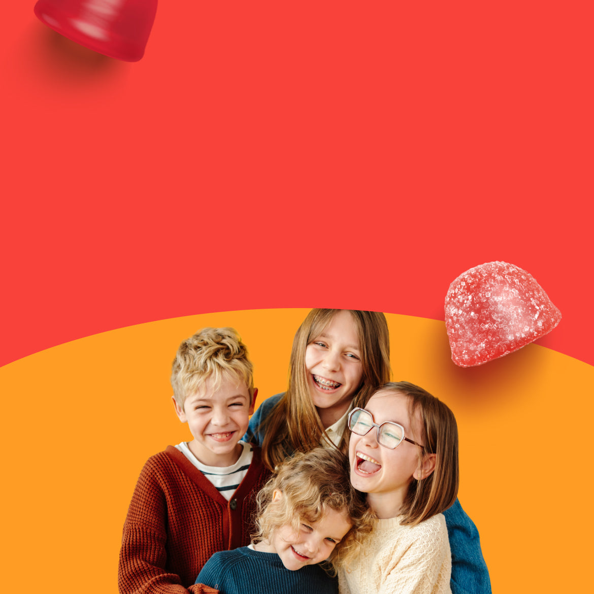 four smiling kids in a group hug