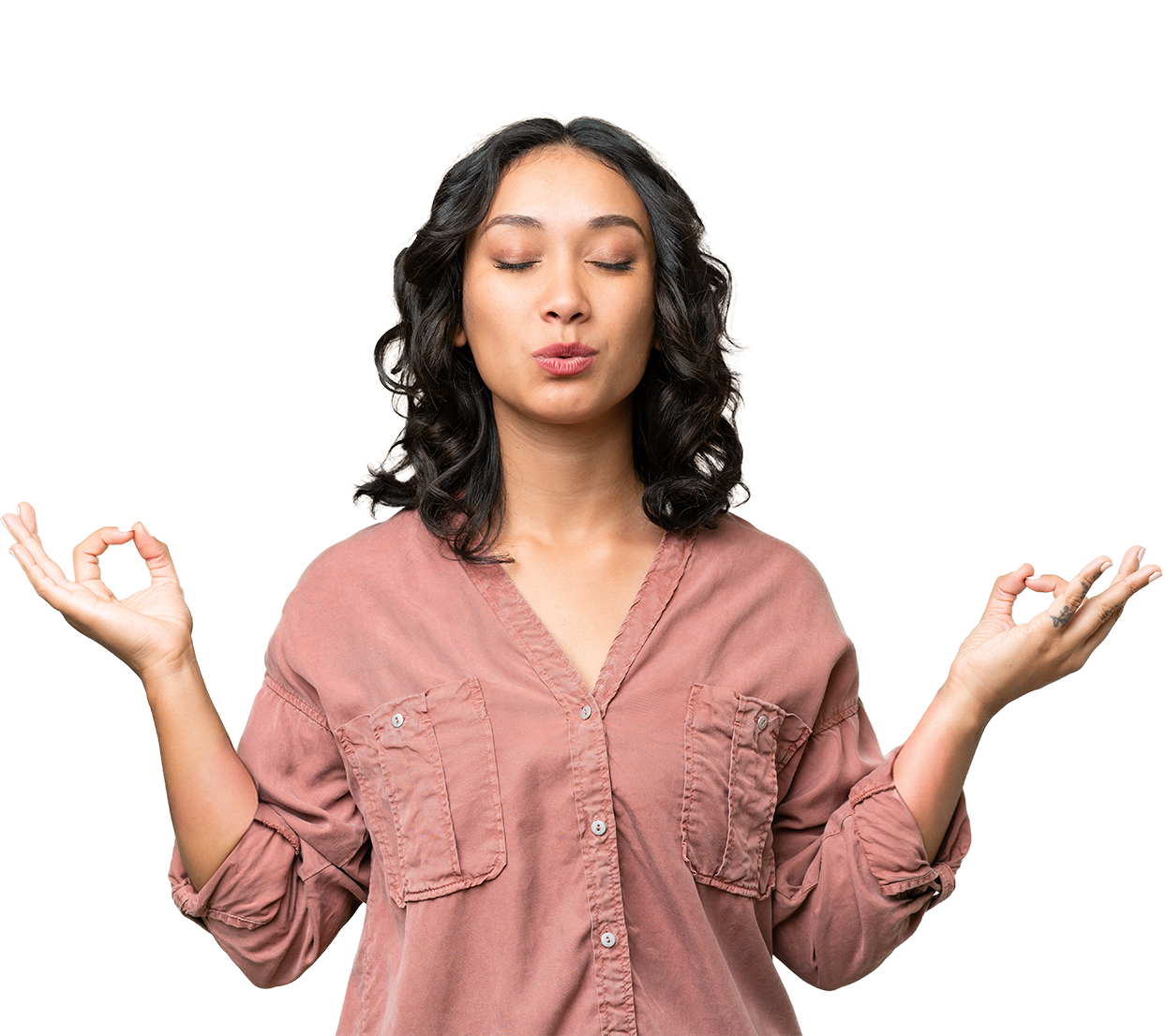 Woman in a pink shirt with hands in a meditative pose