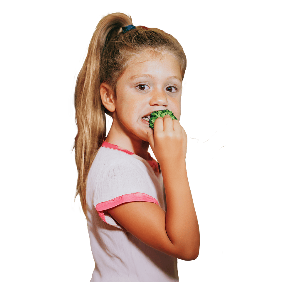 Girl eating broccoli