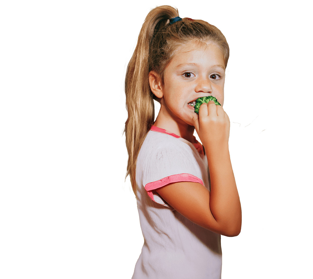 Girl eating broccoli