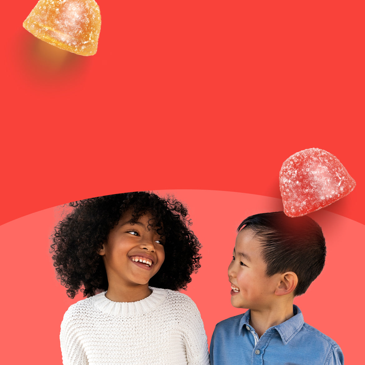 two smiling kids looking at each other