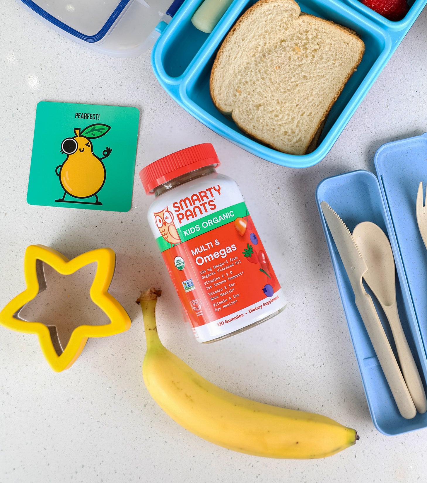 kids organic multi omegas next to a kid's lunch box