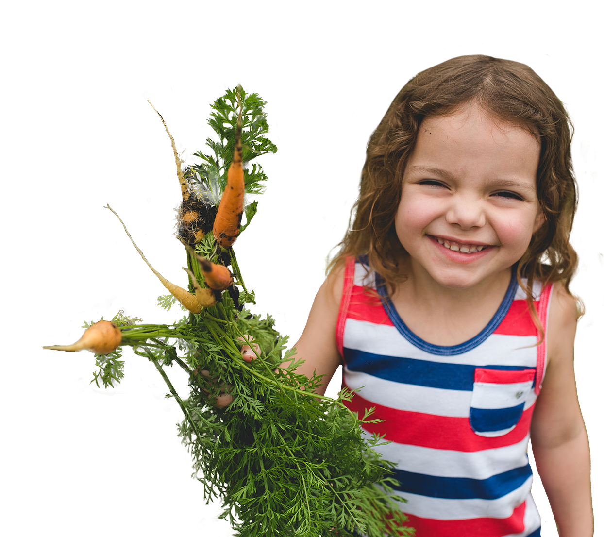 smiling child holding fresh carrots