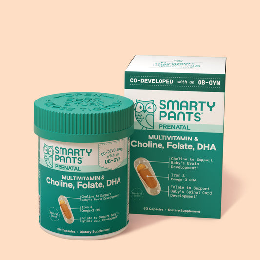 Smartys Pants prenatal supplement jar and packaging on a beige background