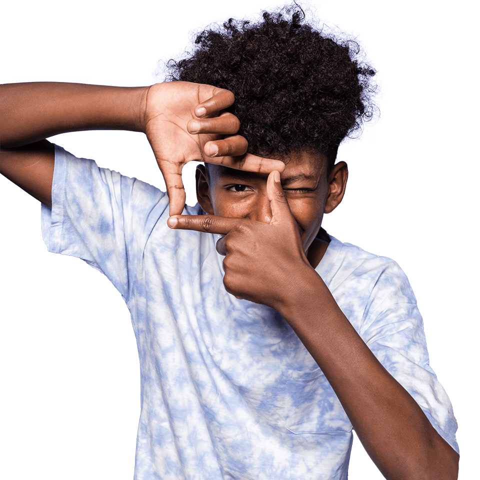 teen guy looking through his fingers in finger frame