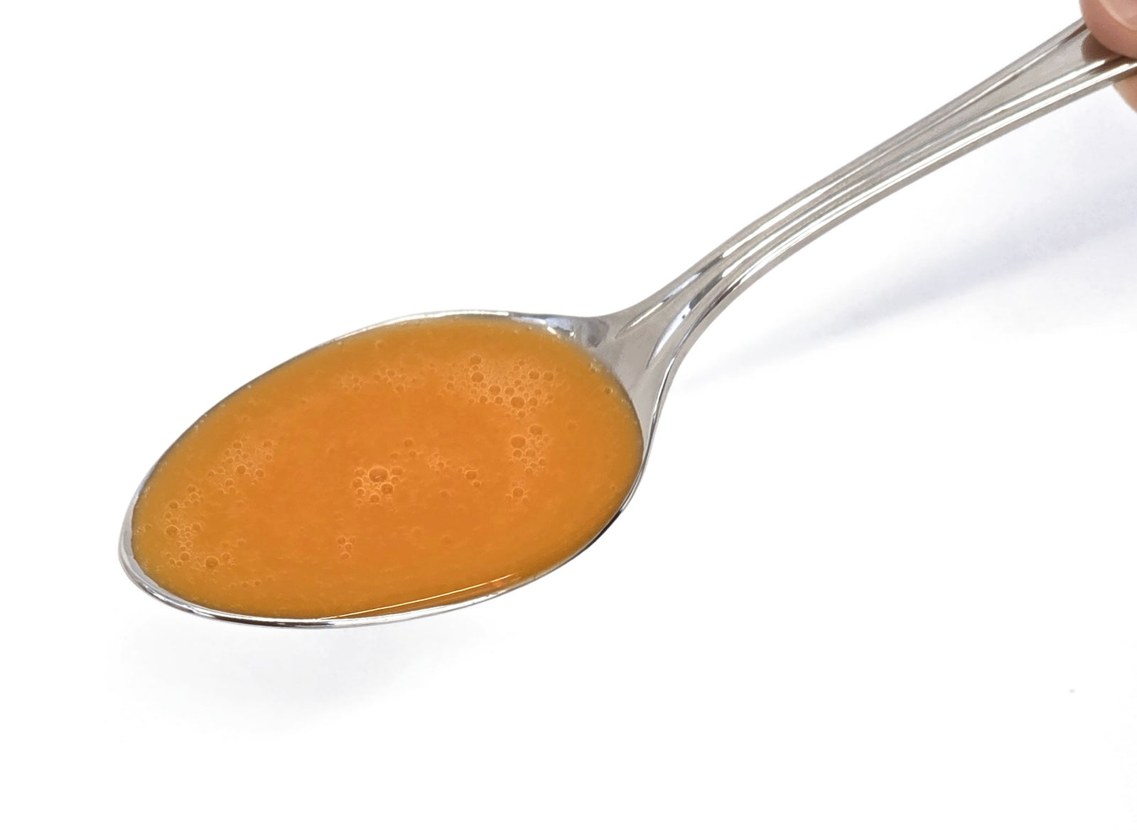 Spoon with Women's Plus Liquid Multivitamin Multimineral